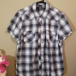It is a plaid shirt with buttons.